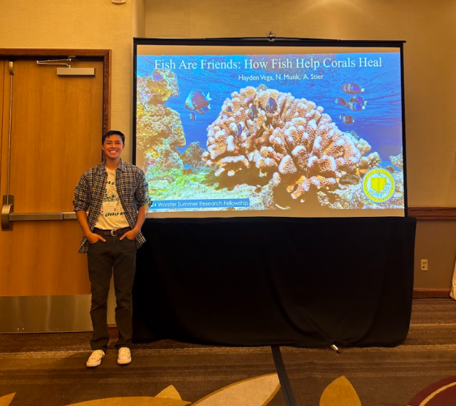 Vega presenting his research: “Fish are Friends: How Fish Help Corals Heal”